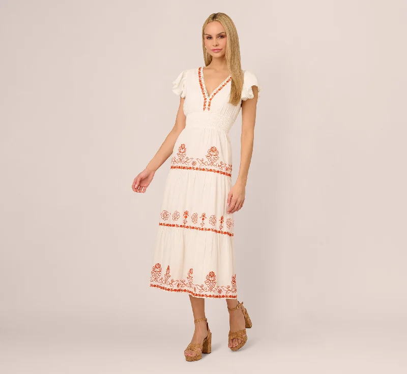 Spring dresses for sunny days with cool fabrics -Embroidered Flutter Sleeve Tiered Midi Dress In Ivory Red Multi Spring dresses for sunny days with cool fabrics -Embroidered Flutter Sleeve Tiered Midi Dress In Ivory Red Multi